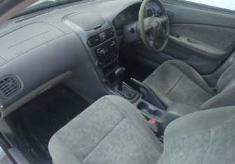 Подержанный автомобиль Nissan Sunny Sedan 2000 года (12 фото)