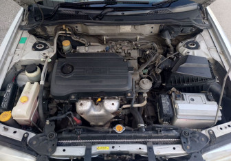 Подержанный автомобиль Nissan Sunny Sedan 2000 года (13 фото)
