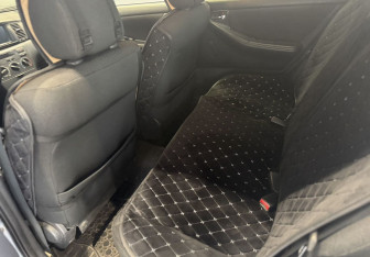 Подержанный автомобиль Toyota Corolla Hatchback 2005 года (15 фото)