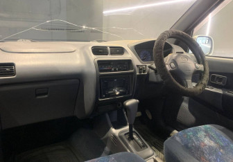 Подержанный автомобиль Toyota Cami 2000 года (12 фото)