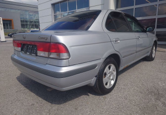 Подержанный автомобиль Nissan Sunny Sedan 2000 года (7 фото)