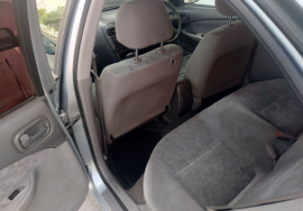 Подержанный автомобиль Nissan Sunny Sedan 2000 года (11 фото)