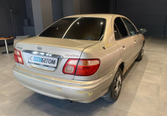 Подержанный автомобиль Nissan Sunny Sedan 2001 года (7 фото)