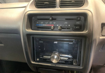 Подержанный автомобиль Toyota Cami 2000 года (14 фото)